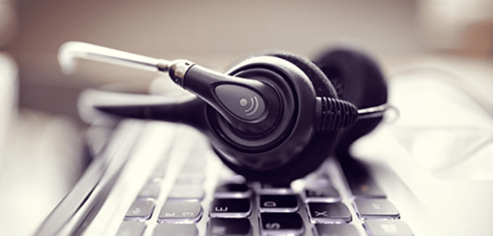 Call center headset on computer keys