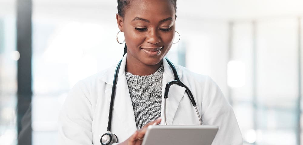 Healthcare worker checking information on device